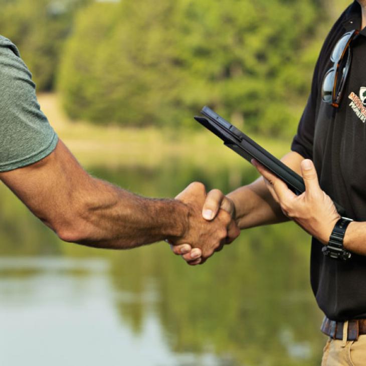 Land Guy shaking hands